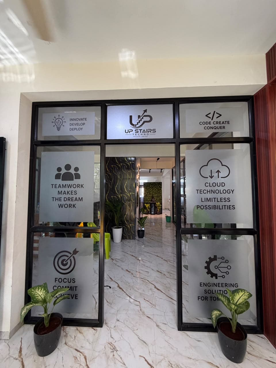 Upstairs Techno branded glass entrance lobby
