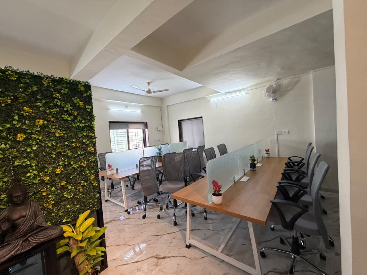 Ergonomic workstations with plant wall and calm environment