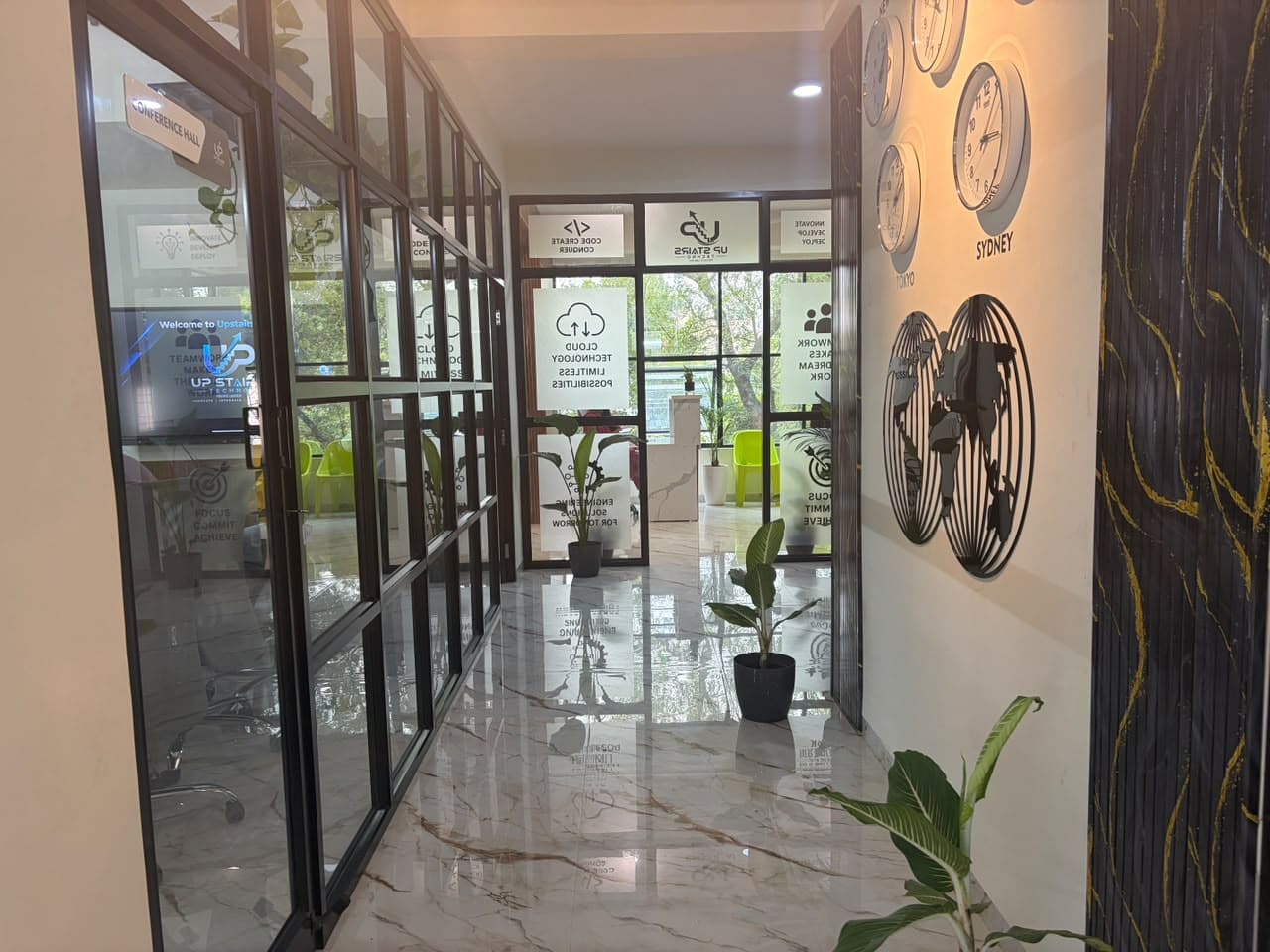 Glass partition conference hallway with marble flooring